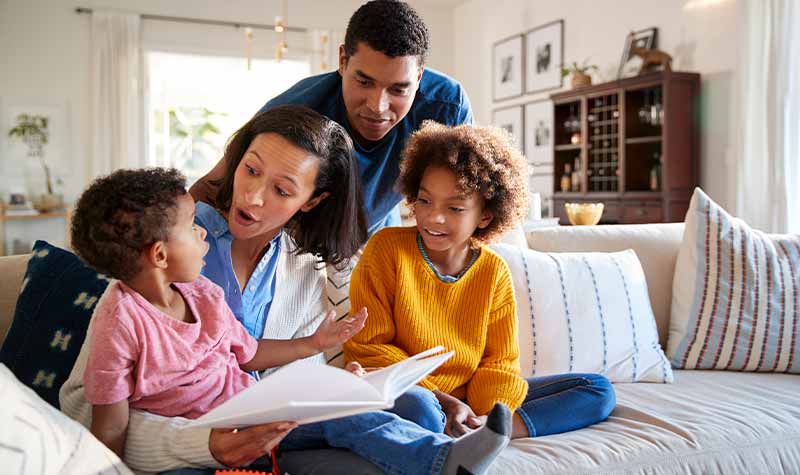 Reviews Reviews hero image - Family reading a book together
